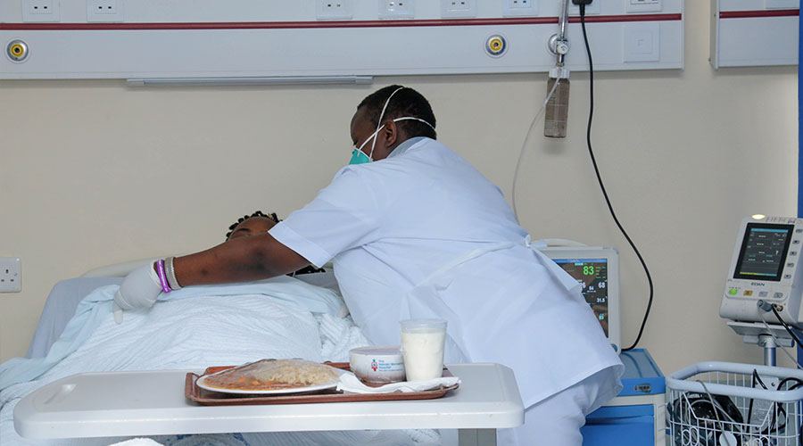 Doctor attending to a patient in a HDU/ICU unit